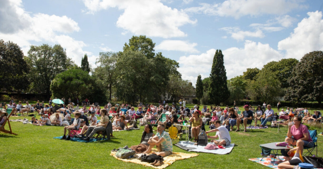 spectators watch sport on the big screen in a Merton park