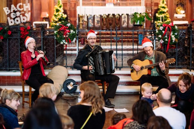 guitarists playing at a bach to baby concert